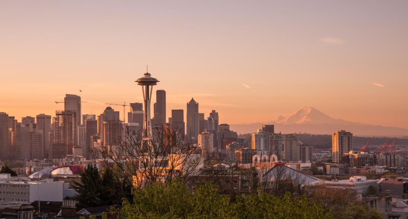 seattle skyline with space needle and buildings at sunrise
