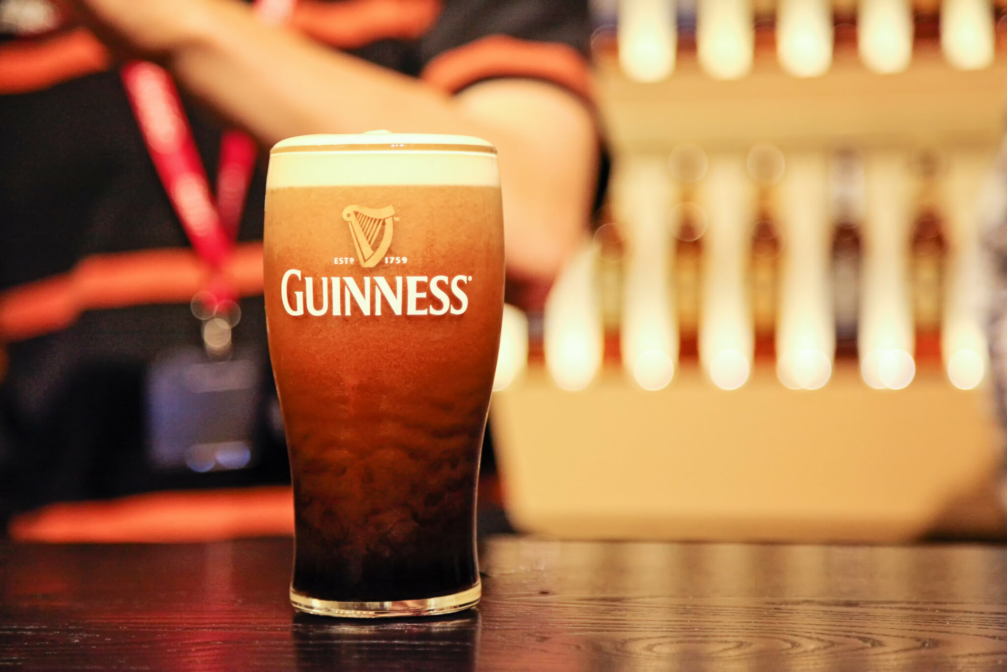 Close-up shot of a pint class of Guinness beer