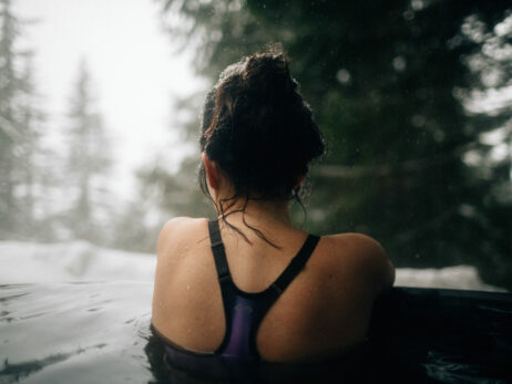 Woman soaks in hot springs