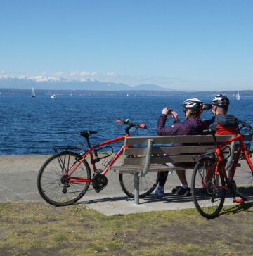 Bikers-sit-on-bench-on-trails-in-washington-state